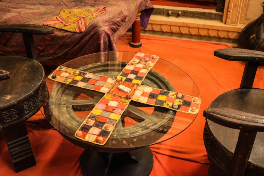 Chaupar-chopad is a cross and circle board game similar to pachisi, played in India. The game board display in Patwon Ki Haveli.